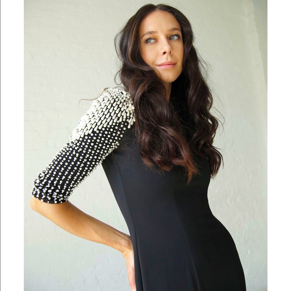Gabrielle M. Luxury evening gown. With hand beaded pearls on the sleeves.